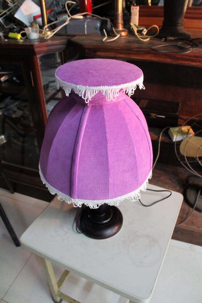 Dress Purple Shade with wooden base table lamp.